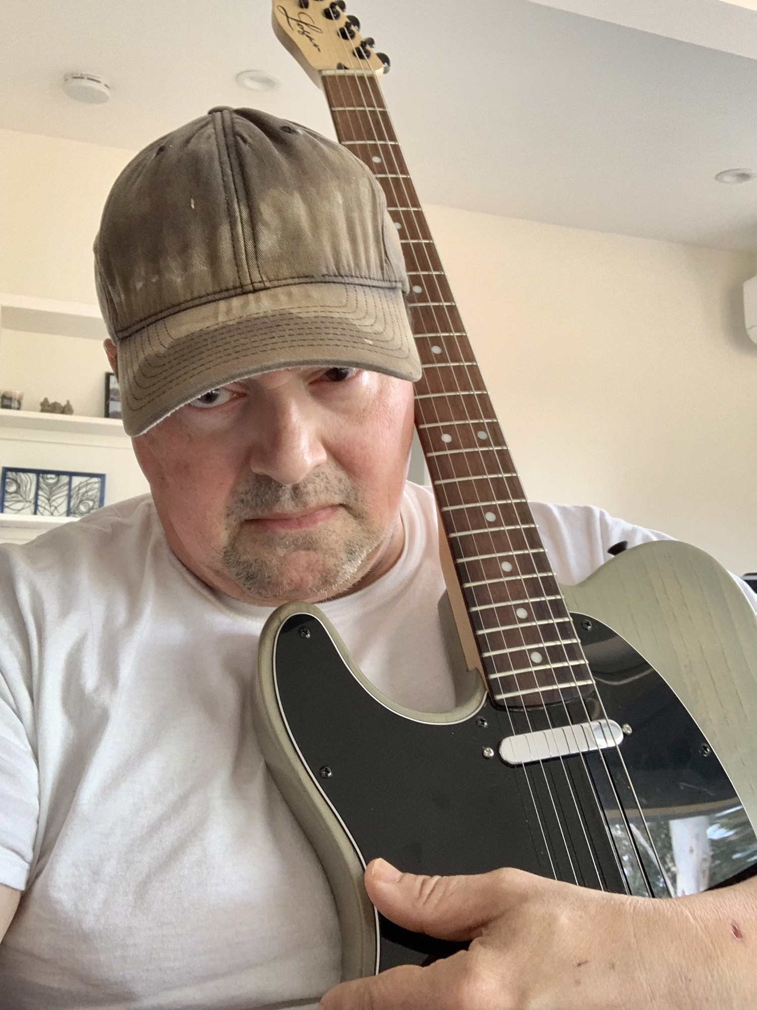 Ted holding a left-handed electric guitar