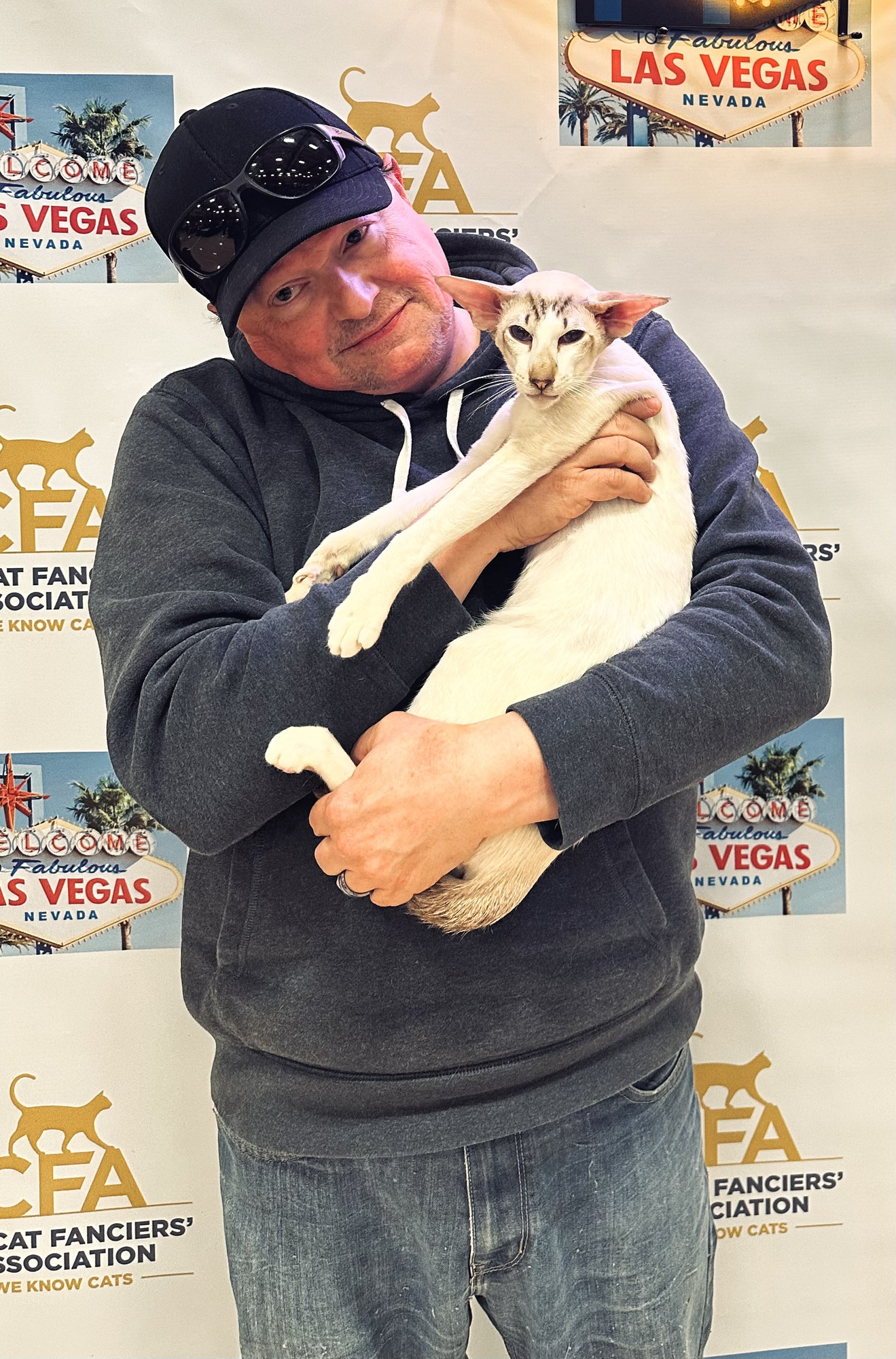 Ted holding an Oriental Shorthair at a CFA cat show